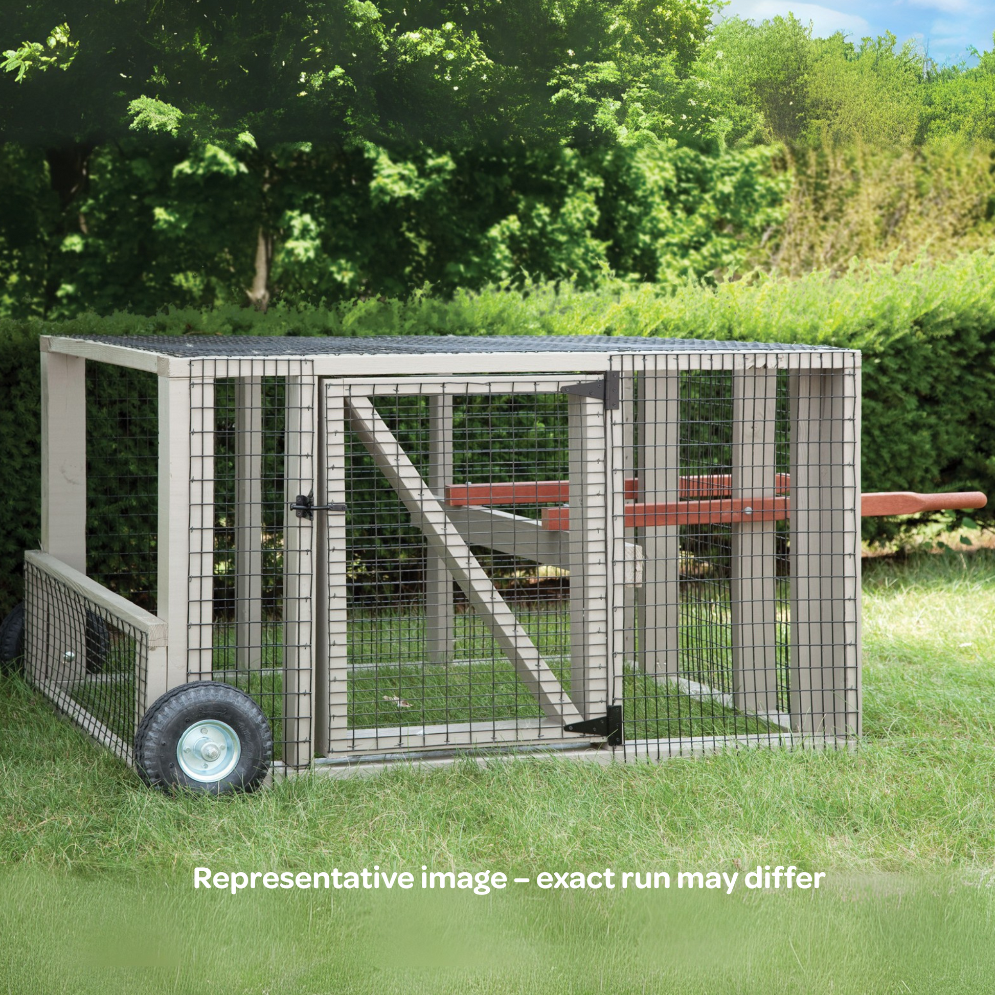 Outdoor backyard run with wheels on a grassy area with trees in the background