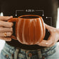 Orange pumpkin-shaped 19 oz ceramic coffee mug