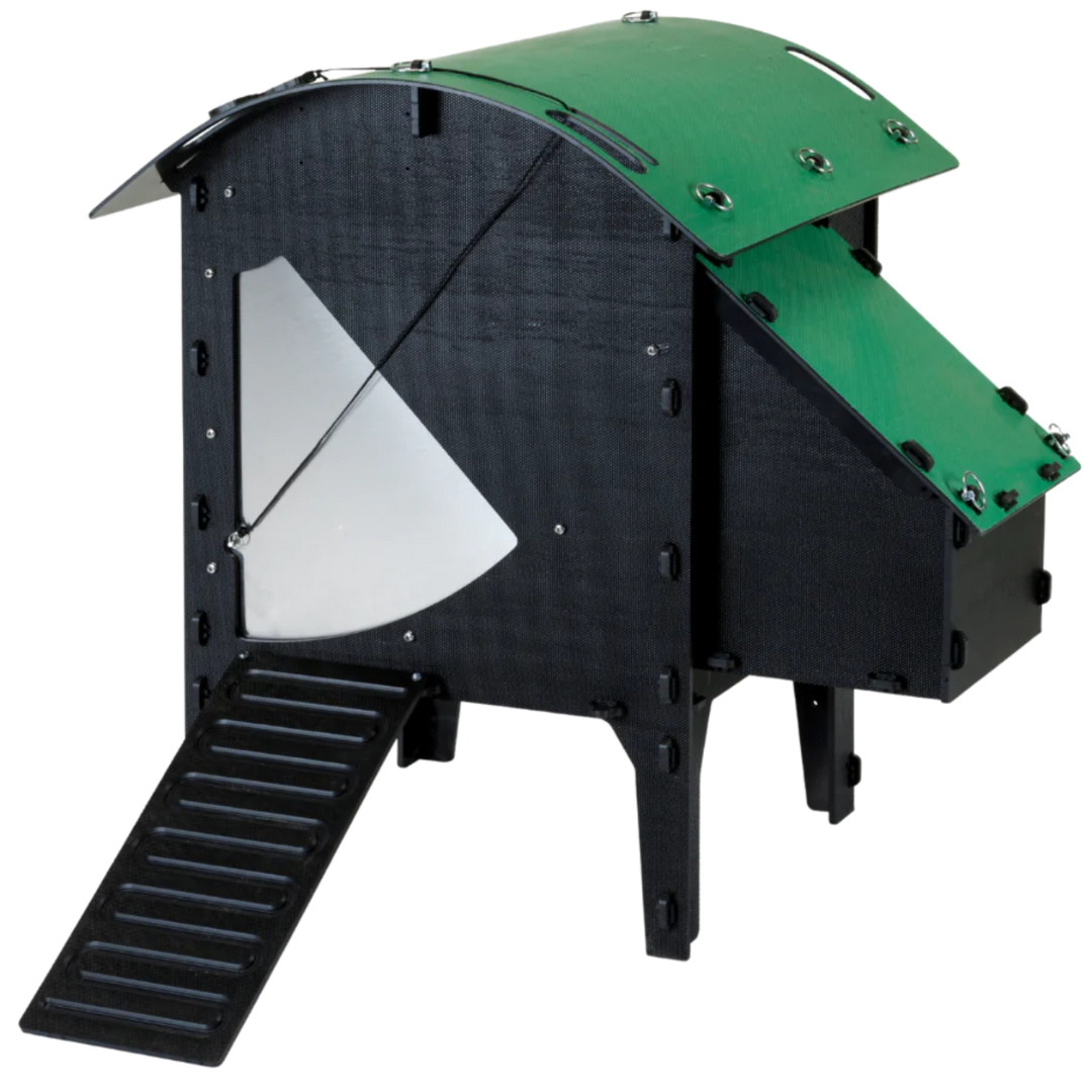 The Small Lodge Chicken Coop by Nestera is elevated off of the ground to add additional protection from rain.