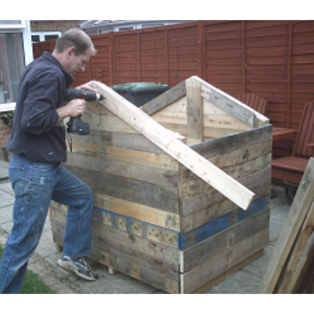 Using wood pallets is an inexpensive way to build a coop. 